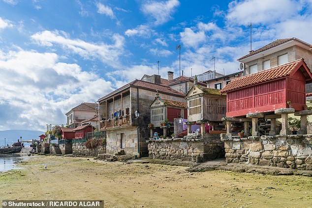 Combarro is famous for its 60 stone horreos (pictured), which can be found along the coastline and are best seen at low tide. These are raised structures that were built to store grain and other food in the Middle Ages.